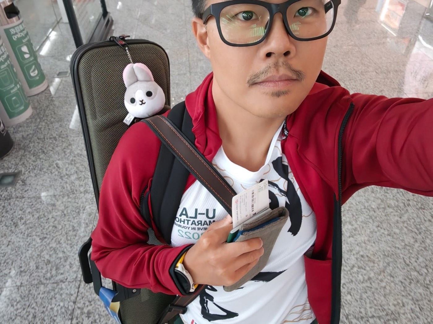 Traveler with erhu case at airport